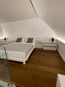 Posteľ alebo postele v izbe v ubytovaní Glorizio Loft Tropea