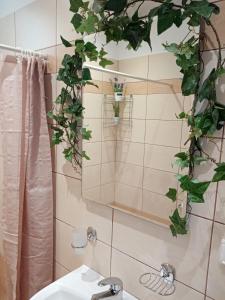 a bathroom with a sink and a mirror at Roses 2 in Skala Sotiros +43 photos