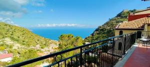 a view of the ocean from the balcony of a house at Casa Pasitea in Taormina