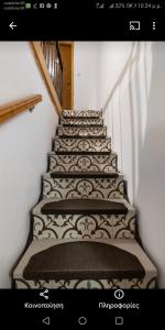 a stairway with a black and white design on it at Hera Studios in Chania