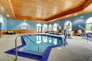 a large swimming pool in a large room at Holiday Inn Express & Suites Aurora - Naperville, an IHG Hotel in Aurora