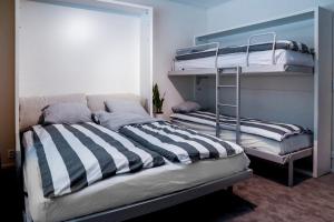 a bedroom with two bunk beds in a room at Holiday Apartment Usva Studio II in Suomutunturi