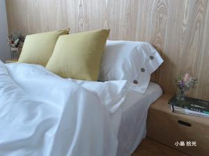 Postel nebo postele na pokoji v ubytování 小島拾光 宜蘭田間包棟民宿Taiwan Yilan Private Villa Paddy view with tranquil & chill vibes