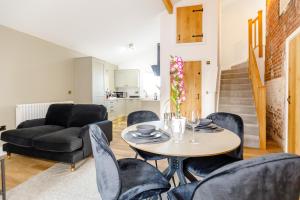 a living room with a table and chairs at The Willow in Selby