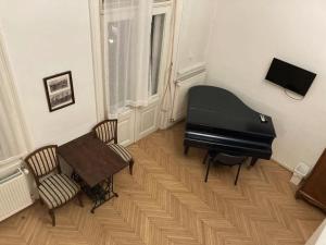 Televízia a/alebo spoločenská miestnosť v ubytovaní A10 Budapest Center Aparthotel