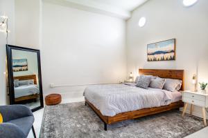 A bed or beds in a room at Spacious Sterchi Loft Getaway- Downtown Getaway