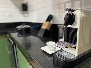 a coffee maker sitting on a counter in a kitchen at Nari Guest Room in Fernando de Noronha