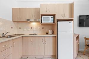 Kuchyň nebo kuchyňský kout v ubytování Taft Apartments