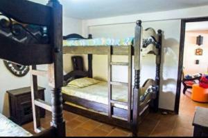 a group of bunk beds in a room at Finca BellaVista, Lago Calima: Hermosos Paisajes in Darién +39 photos