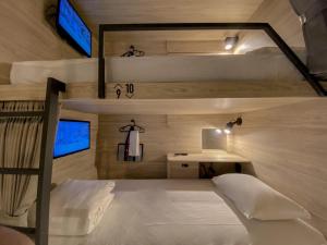Rúm í herbergi á Hotel Leisure Chiayi