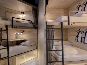 Rúm í herbergi á Hotel Leisure Chiayi