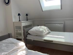 מיטה או מיטות בחדר ב-Maison de Lervilly - Face à l'Océan
