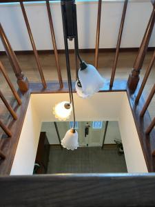 three lights hanging from the ceiling of a building at 別府ホーム in Beppu
