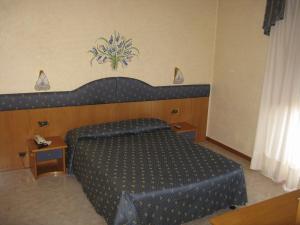 Cama o camas de una habitación en Hotel Faro