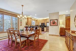 a kitchen and dining room with a wooden table and chairs at Cozy Mountain 4-Bedroom Retreat in Arrowhead Village townhouse in Edwards