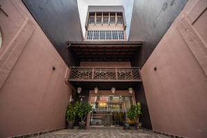 an internal view of a building with tall ceilings at Link Hotel in George Town