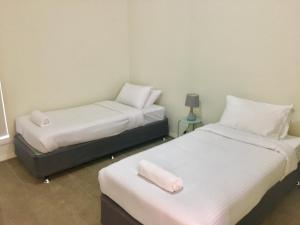 Postel nebo postele na pokoji v ubytování Wagga Apartments #7