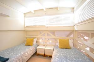 En eller flere senge i et værelse på THE DUNES + 100M TO BEACH + POOL + EXCEPTIONAL LOCATION