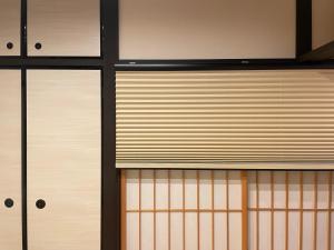 a close up of a kitchen with sliding glass doors at 香柏 西京極 - Kouhaku Nishikyogoku, Kyoto Machiya in Kyoto
