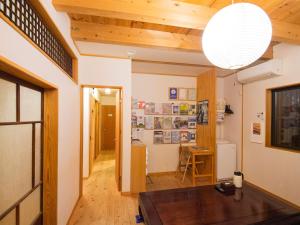 
a living room filled with furniture and a window at Guest House Wakabaya in Takamatsu
