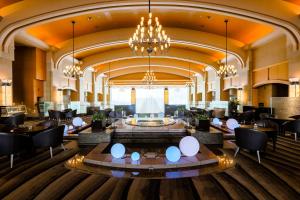 a lobby of a hotel with a chandelier at The Windsor Hotel Toya Resort & Spa in Lake Toya