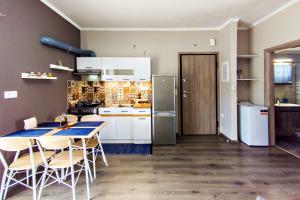 A kitchen or kitchenette at Maria's modern studio 5min from beach