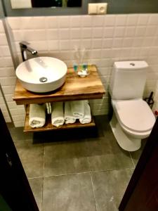 a bathroom with a white sink and a toilet at Old Town Mtatsminda in Tbilisi City