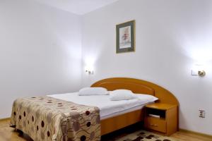 Postel nebo postele na pokoji v ubytování Hotel Select + 37 fotografií