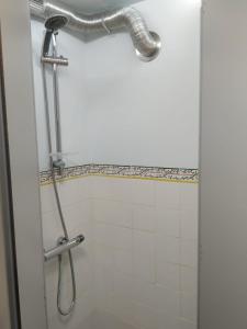 a shower in a bathroom with a shower curtain at Quinta dos Campos - Apartamento 1 in Braga