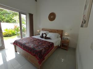 Tempat tidur dalam kamar di Villa Bukit Sweet Home