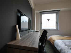 Sjónvarps- og/eða afþreyingartæki á Hotel Comfybed Ginza