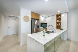 A kitchen or kitchenette at The Gallery Residences Broadbeach
