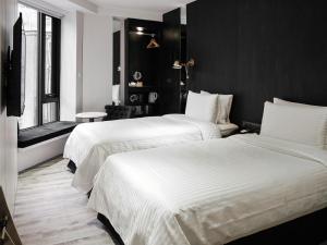 Katil atau katil-katil dalam bilik di Hotel Relax III