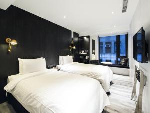 Katil atau katil-katil dalam bilik di Hotel Relax III