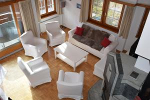 an aerial view of a living room with white furniture at Flamingo in Saas-Fee