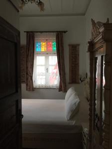 Postel nebo postele na pokoji v ubytování CavlıHane 1885