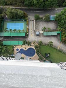 an aerial view of a resort with a swimming pool at Beach Resort Home Stay Batu Ferringhi 02 in Batu Ferringhi