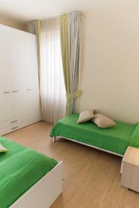 Postel nebo postele na pokoji v ubytování Resort Cupra