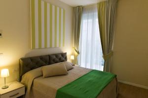 Postel nebo postele na pokoji v ubytování Resort Cupra
