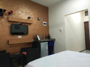 TV i/ili multimedijalni sistem u objektu Relax House For Studio Rooms Apartment