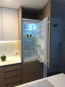 an empty refrigerator with its door open in a kitchen at Apartamento Adrover - J in Sant Llorenç des Cardassar