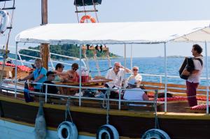 a group of people on a boat on the water at Maistra Camping Amarin Glamping in Rovinj