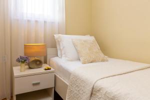 Posteľ alebo postele v izbe v ubytovaní Exclusive Center Apartments