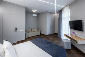 TV a/nebo společenská místnost v ubytování OTAMAN Resort