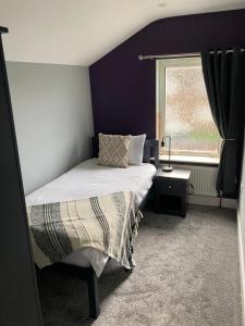 a bedroom with a bed and a window at The Dockyard in Goole