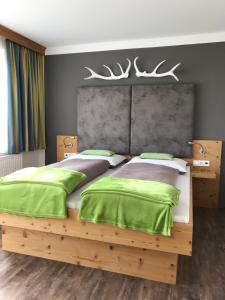 Postel nebo postele na pokoji v ubytování Comfort Hotel Garni Landhaus Gitti