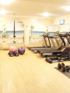 a bowling alley with pins and balls on the floor at Creta Palm Resort Hotel & Apartments in Stalos