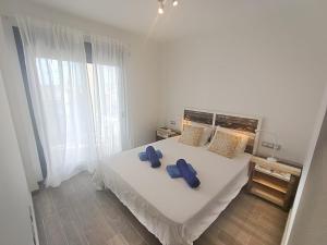 A bed or beds in a room at Ap MAJORERO CALETA