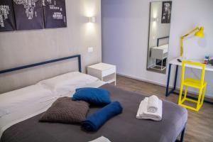 A bed or beds in a room at Central Rooms Matera