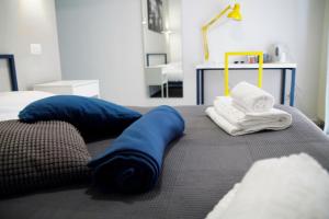 A bed or beds in a room at Central Rooms Matera
